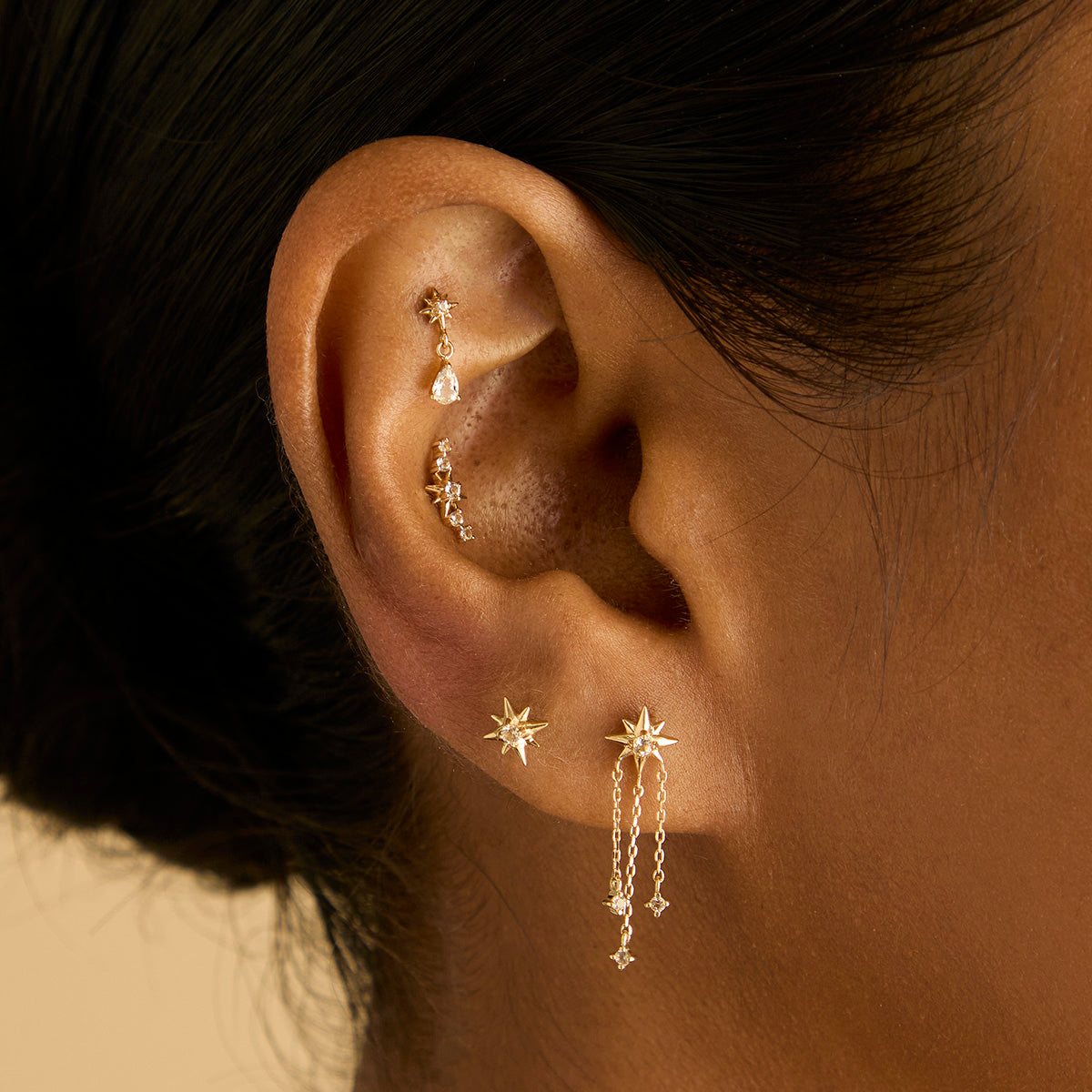 White Topaz Star Studs in Solid Gold