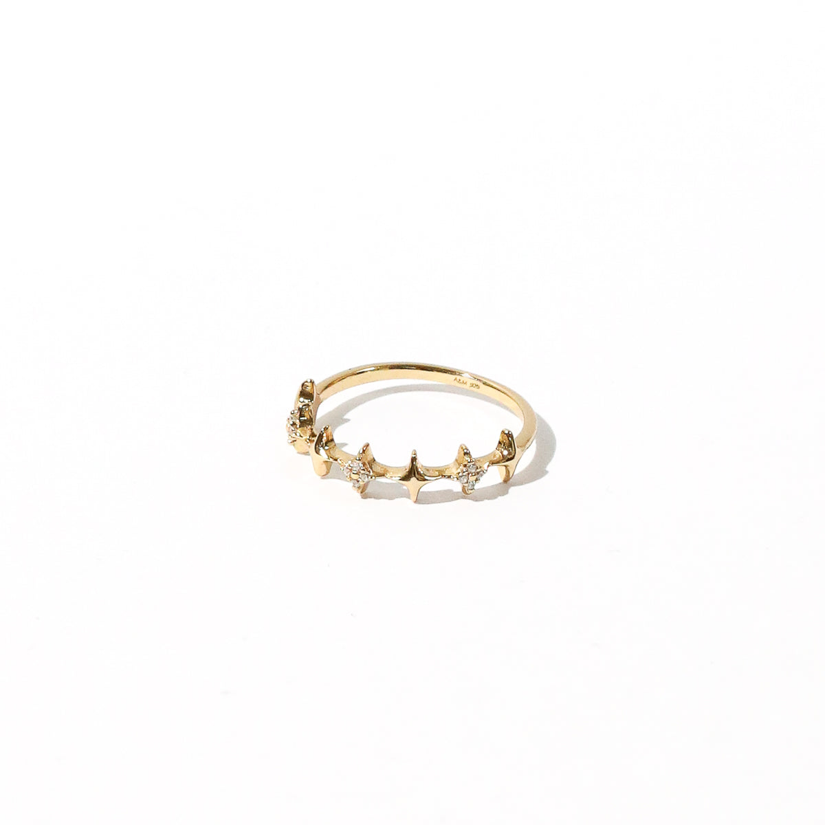 Cosmic Star Stacking Ring in Gold flat lay shot