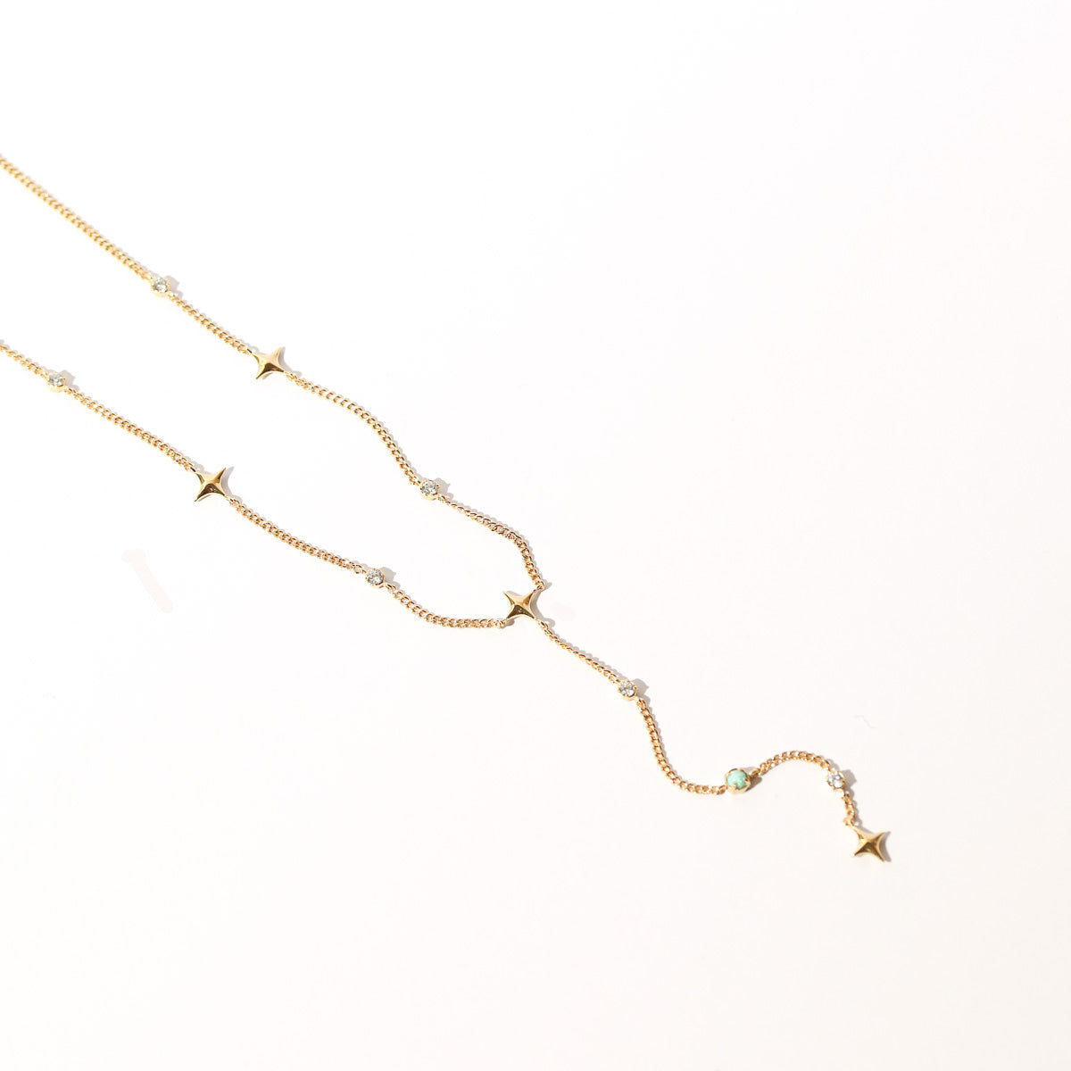 Cosmic Star Opal Lariat Necklace in Gold flat lay