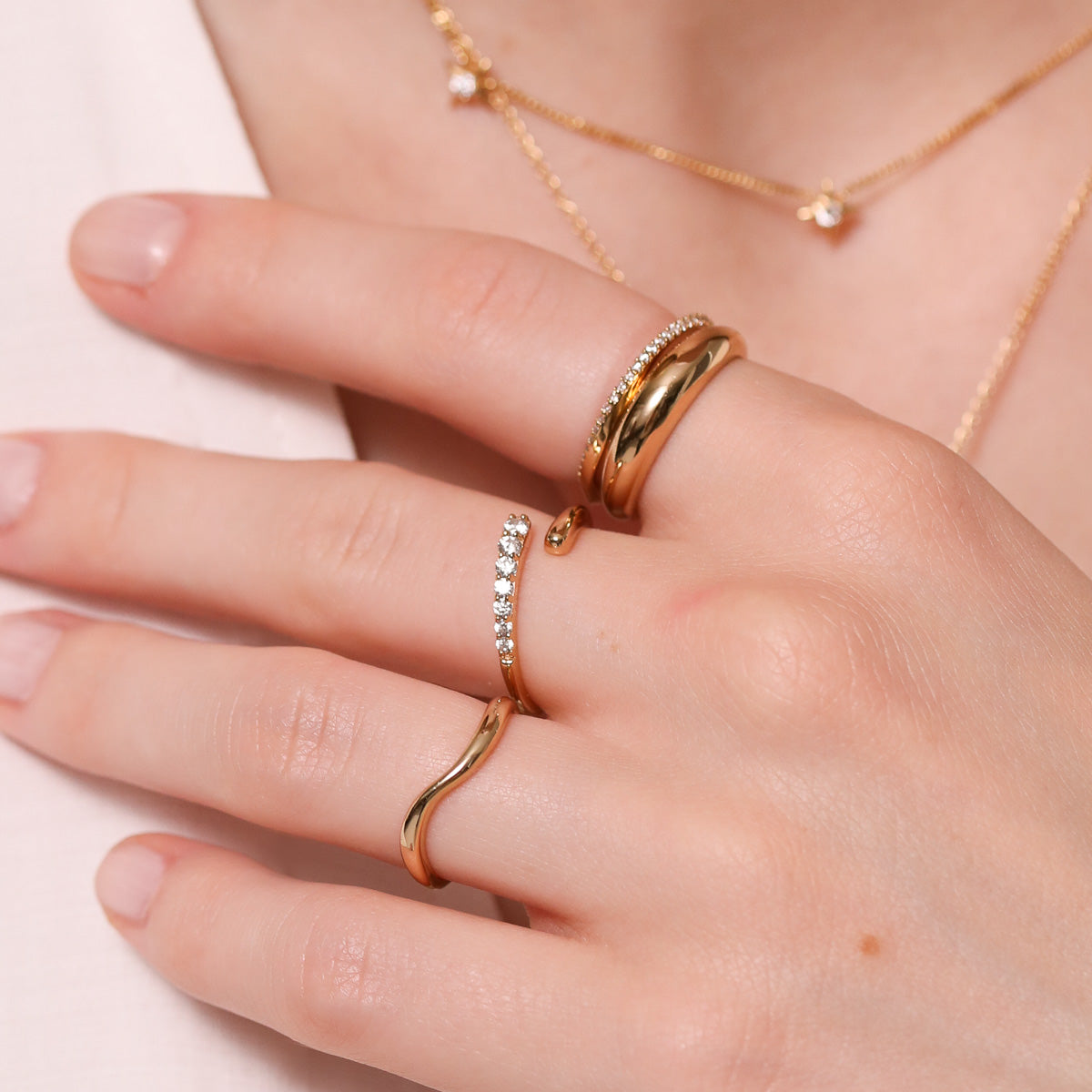 Orbit Crystal Ring in Gold Worn with other rings