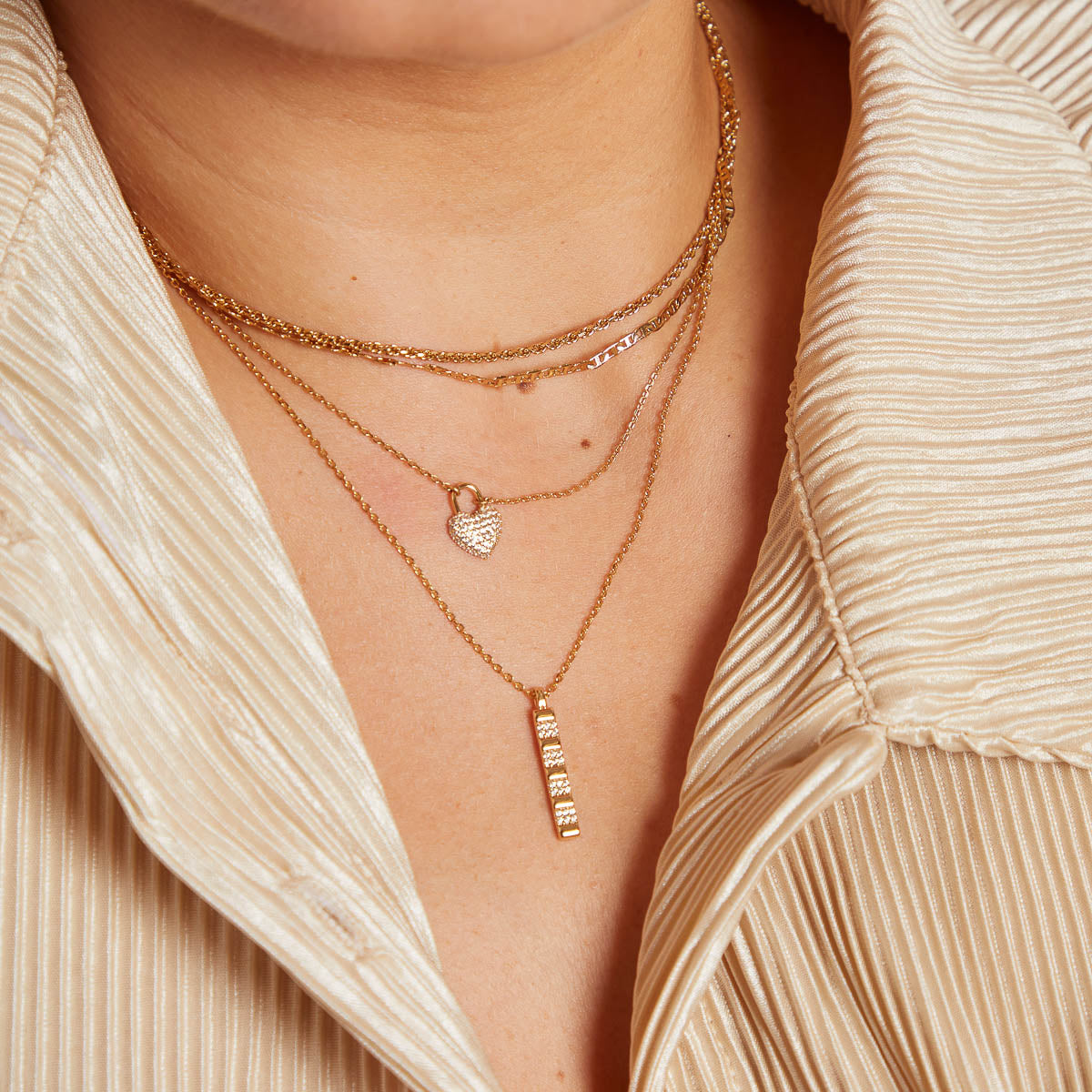 Pleated Crystal Pendant Necklace in Gold worn layered with necklaces