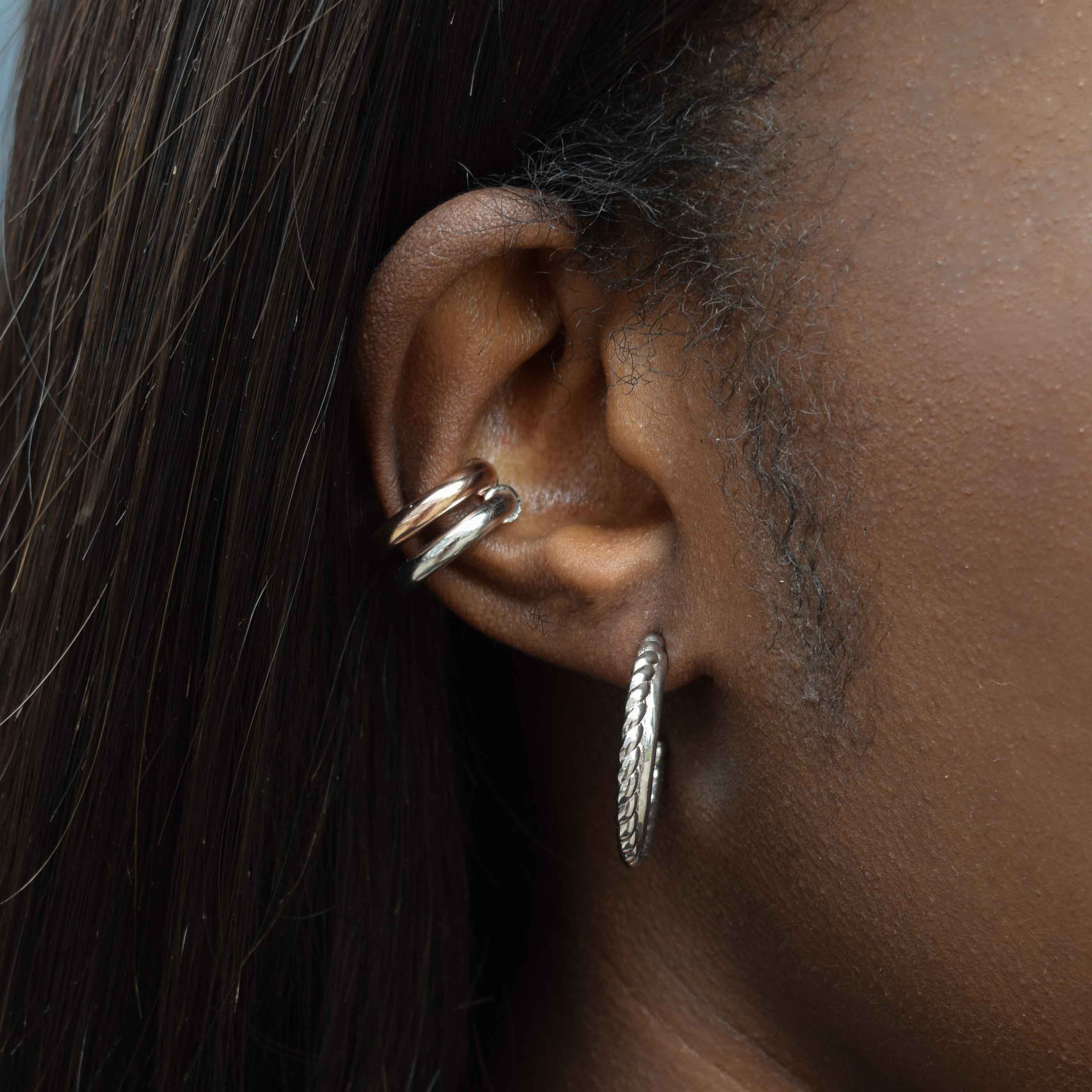 Chunky Ear Cuff in Silver worn with interlocked band hoops in silver