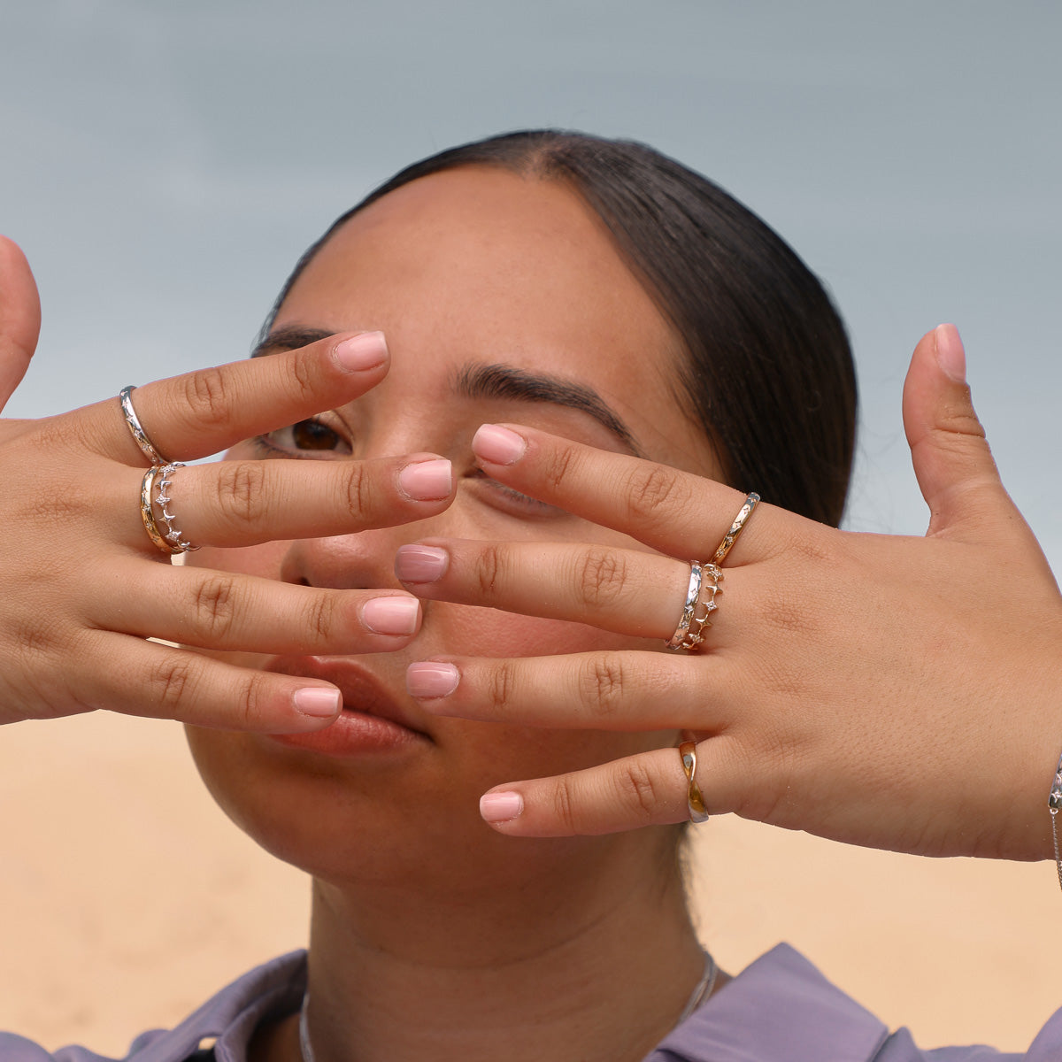 Cosmic Star Stacking Rings in Gold & Silver worn with Cosmic Star Band Rings in Gold and Silver