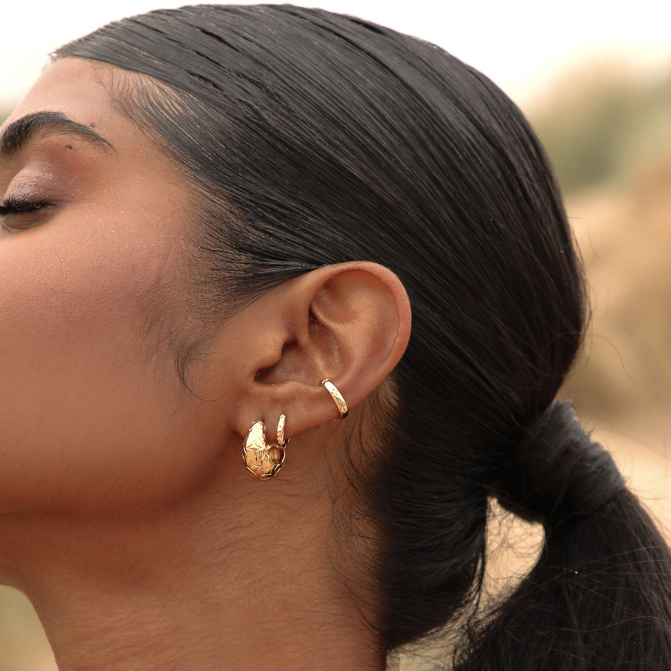 Cosmic Star Ear Cuff in Gold worn