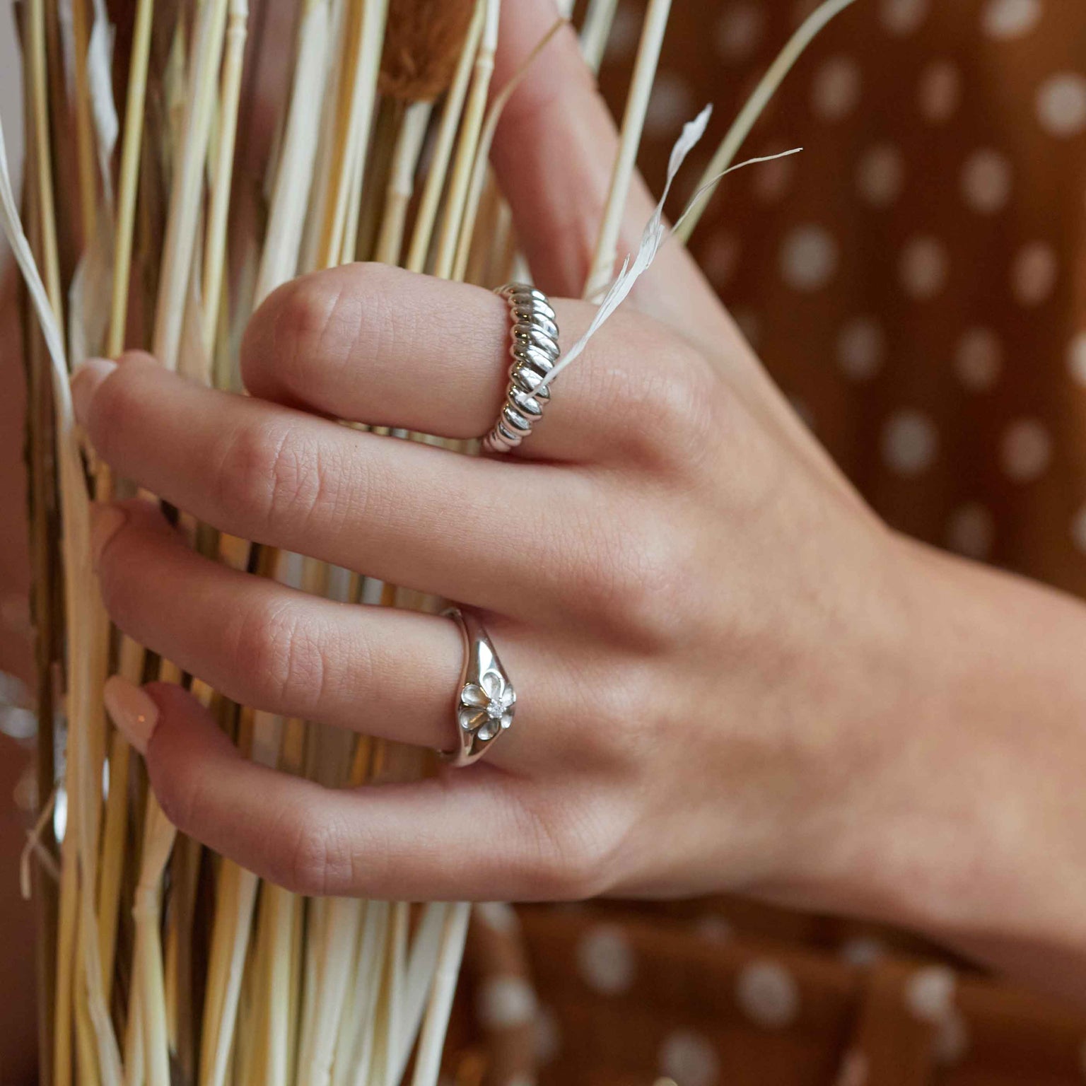 Rope Dome Ring in silver worn with flora signet ring